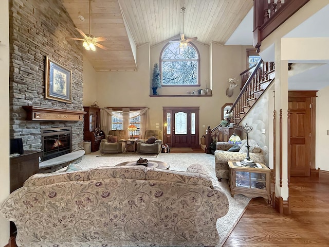 11307 Timber Lane Rd, Lena, IL 61048 - living area featuring ceiling fan, healthy amount of natural light, wood finished floors, a stone fireplace, and wooden ceiling