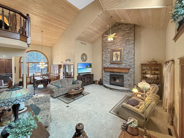 carpeted living area with wooden ceiling, a fireplace, and high vaulted ceiling