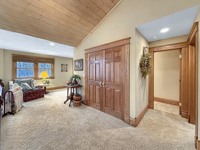 interior space with baseboards, wood ceiling, carpet, vaulted ceiling, and recessed lighting