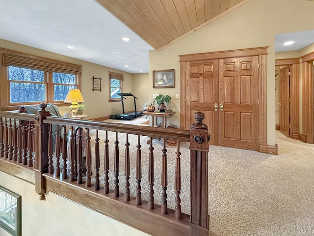 interior space featuring baseboards, lofted ceiling, wood ceiling, carpet floors, and recessed lighting