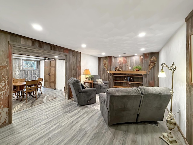 11307 Timber Lane Rd, Lena, IL 61048 - living room with light wood-style floors, wooden walls, and recessed lighting