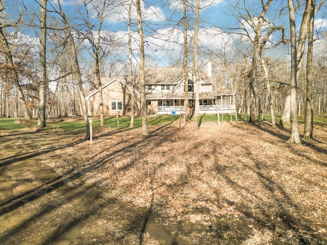 11307 Timber Lane Rd, Lena, IL 61048 - rear view of house with a porch and a yard