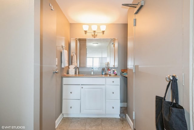 bathroom with vanity and tile patterned floors