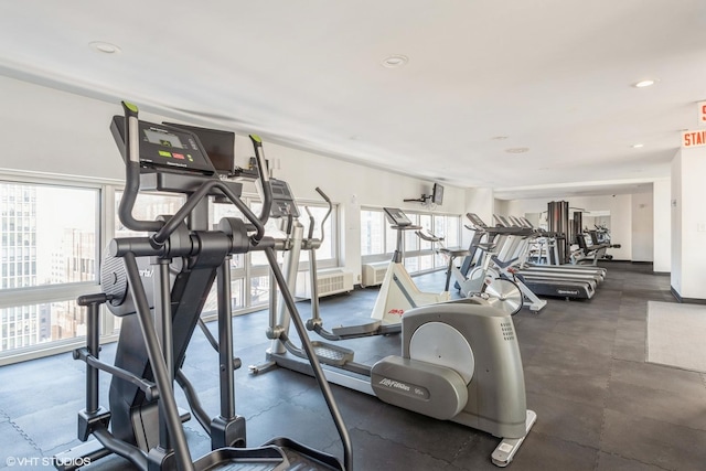 exercise room with recessed lighting