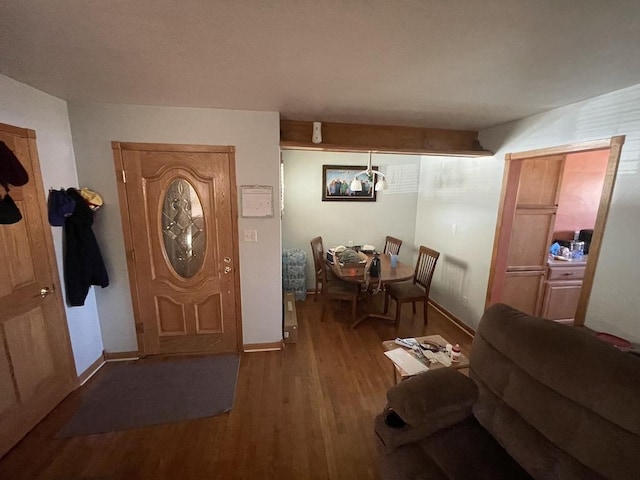 entryway with wood finished floors and baseboards