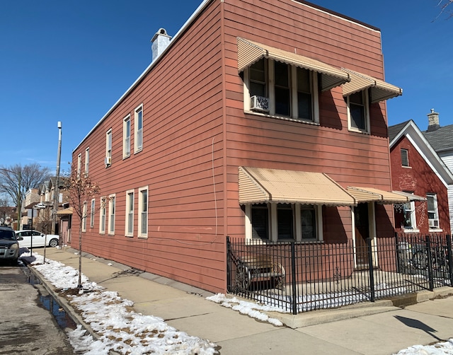 view of home's exterior with fence