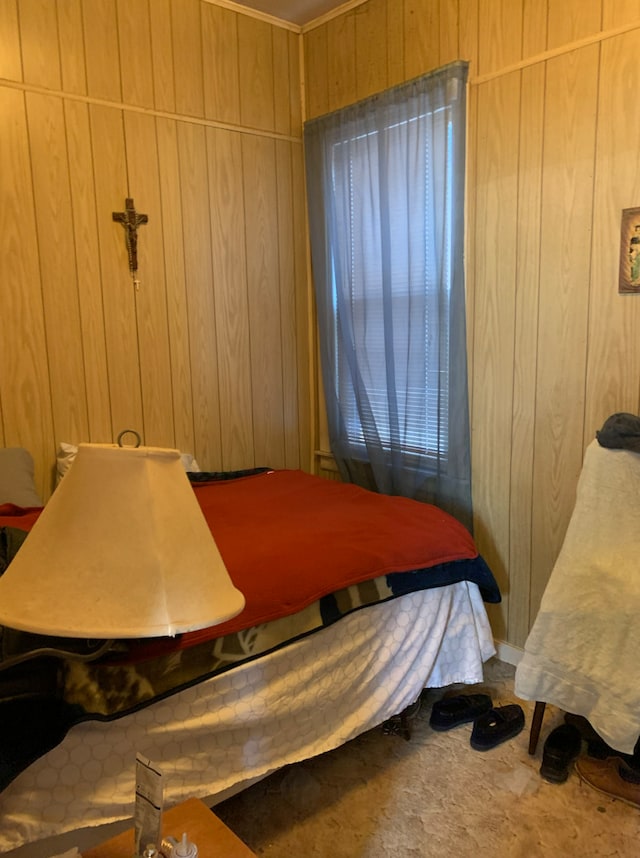 bedroom featuring wood walls