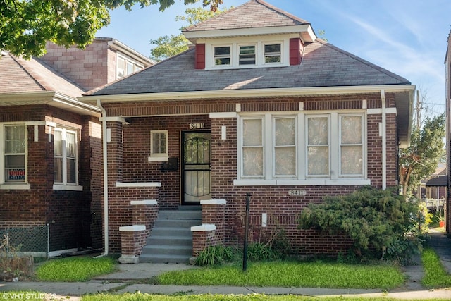 bungalow with brick siding