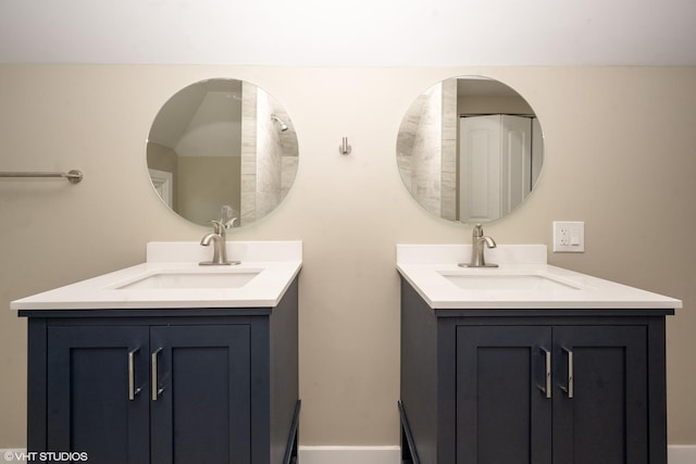 bathroom with two vanities and a sink