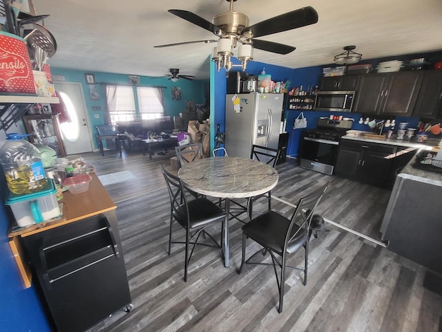 kitchen with dark wood-style floors and stainless steel appliances