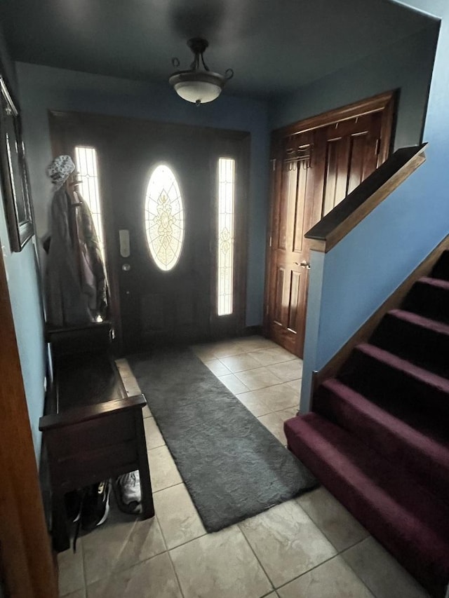 foyer entrance featuring a wealth of natural light and stairway