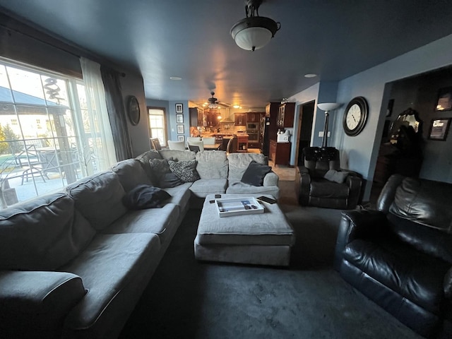 living room featuring a ceiling fan