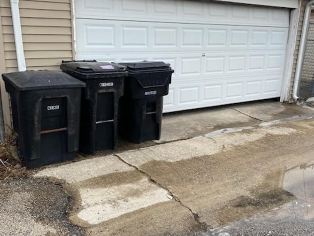 garage with concrete driveway