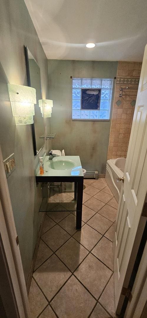 bathroom featuring vanity, washtub / shower combination, and tile patterned floors