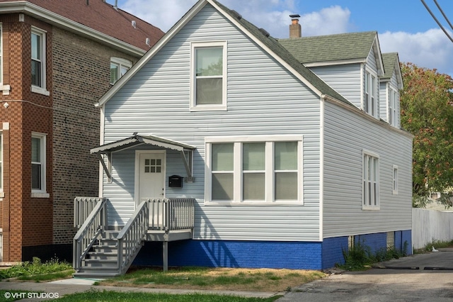 view of front of home featuring a shingled roof