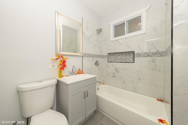 bathroom featuring washtub / shower combination, vanity, and toilet