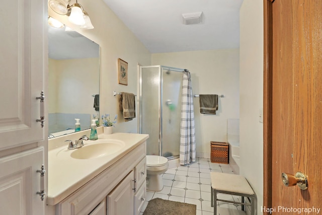 bathroom featuring toilet, visible vents, a shower stall, and vanity