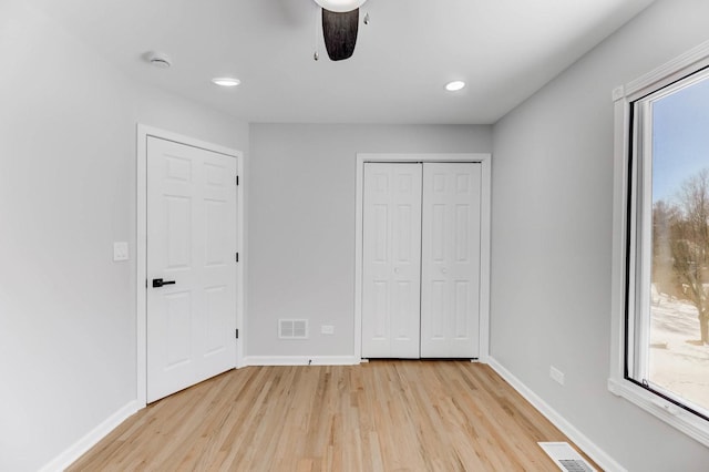 unfurnished bedroom with visible vents and baseboards