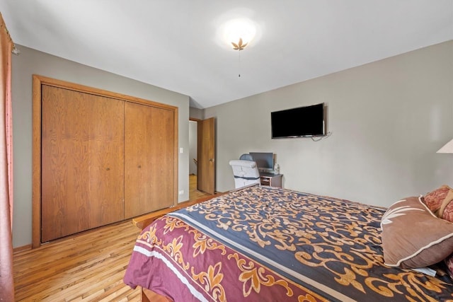 bedroom with a closet and light wood finished floors