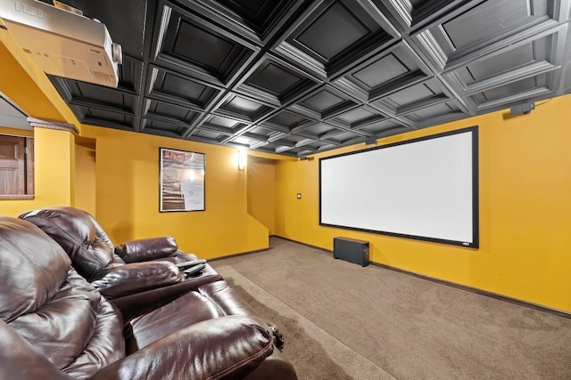 home theater with coffered ceiling, carpet flooring, and baseboards