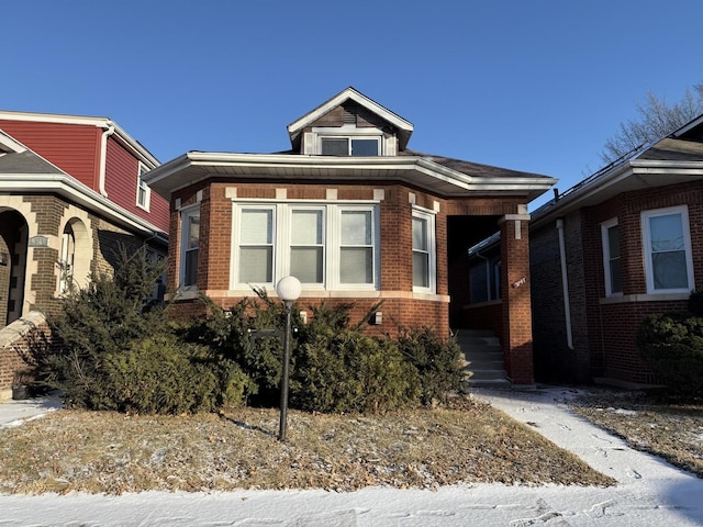 view of front of house featuring brick siding