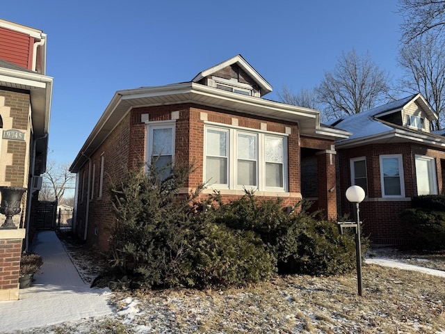 view of front of home featuring brick siding