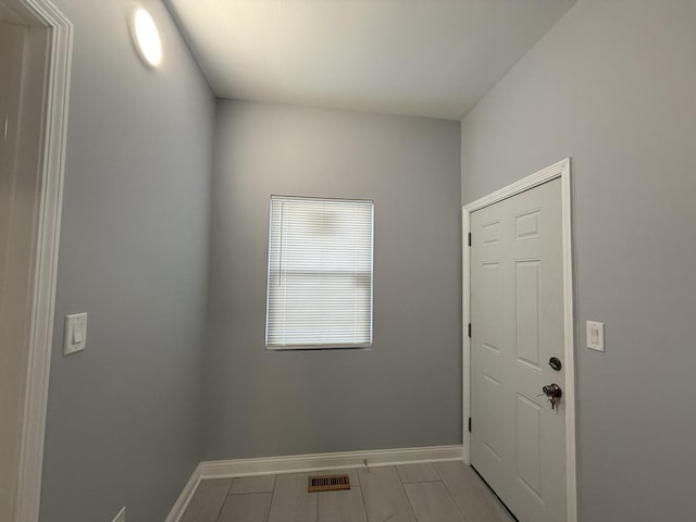 doorway featuring visible vents and baseboards