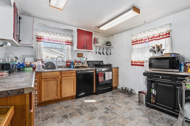 kitchen featuring stone finish flooring, open shelves, a sink, black appliances, and dark countertops