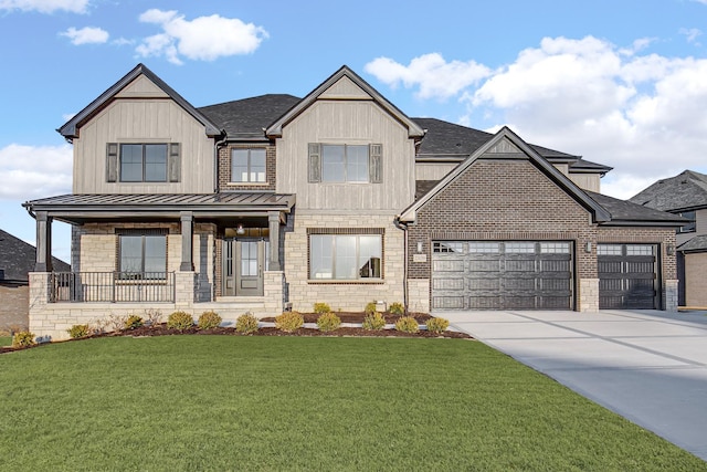 view of front of home with concrete driveway, metal roof, an attached garage, a standing seam roof, and a front lawn