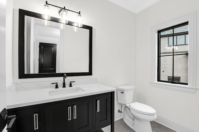 half bath with tile patterned flooring, toilet, vanity, baseboards, and crown molding