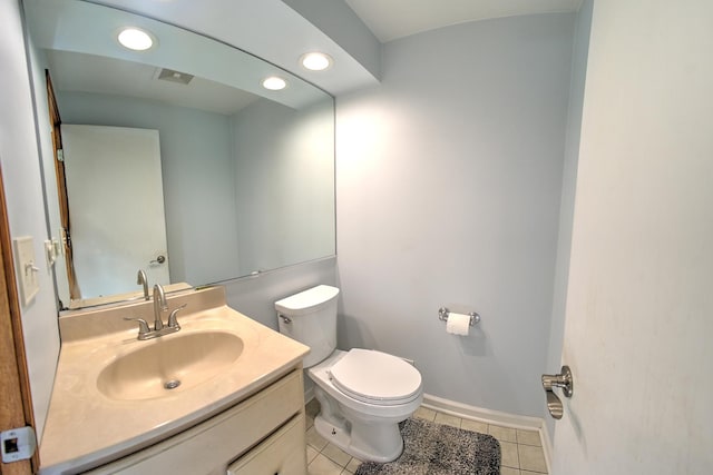 bathroom with recessed lighting, toilet, vanity, tile patterned flooring, and baseboards