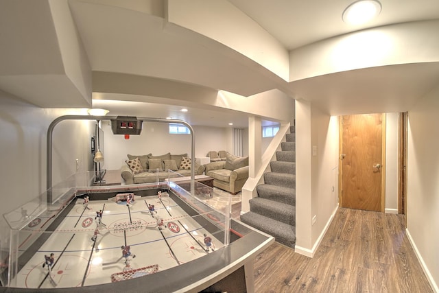 recreation room featuring recessed lighting, baseboards, and wood finished floors