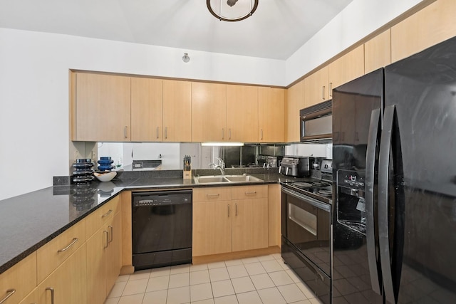 kitchen featuring black appliances, light brown cabinetry, light tile patterned flooring, and a sink