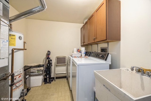 laundry room featuring cabinet space, light floors, water heater, separate washer and dryer, and a sink