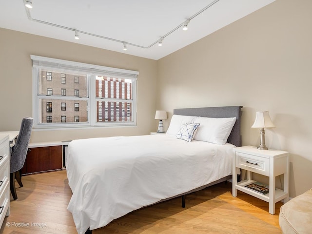 bedroom featuring light wood-style floors