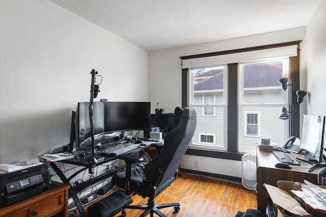 office space with light wood-type flooring