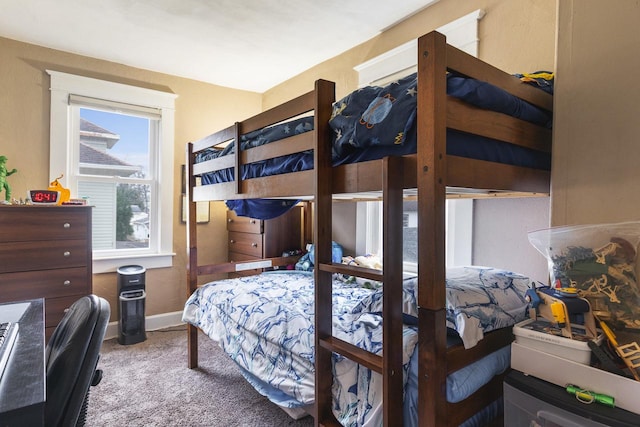 carpeted bedroom with baseboards