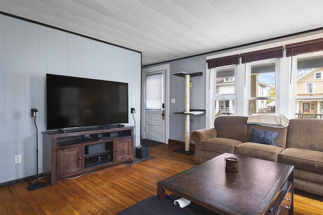 living room featuring wood finished floors and baseboards