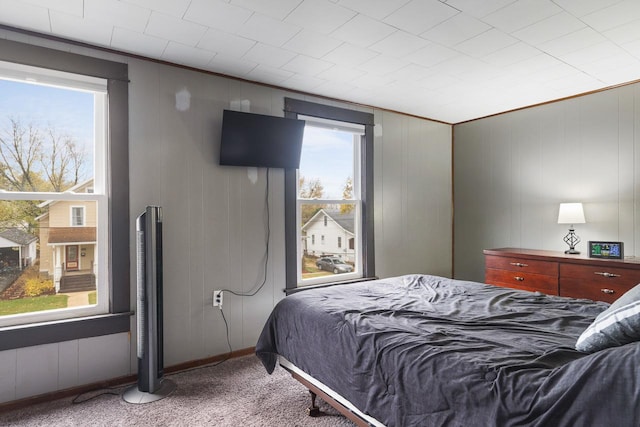 bedroom featuring carpet flooring and crown molding