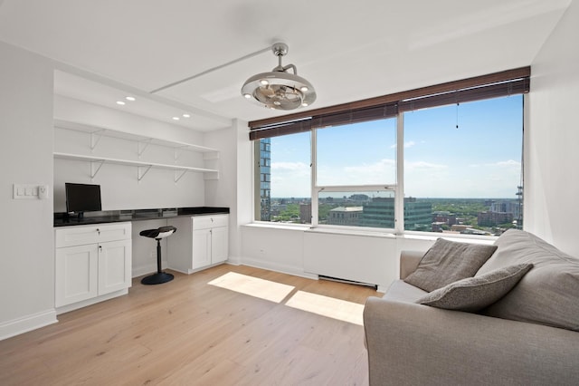 kitchen with white cabinetry, a view of city, open shelves, light wood finished floors, and dark countertops