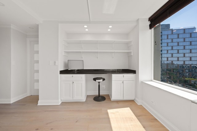 interior space with light wood-style flooring, baseboards, and recessed lighting