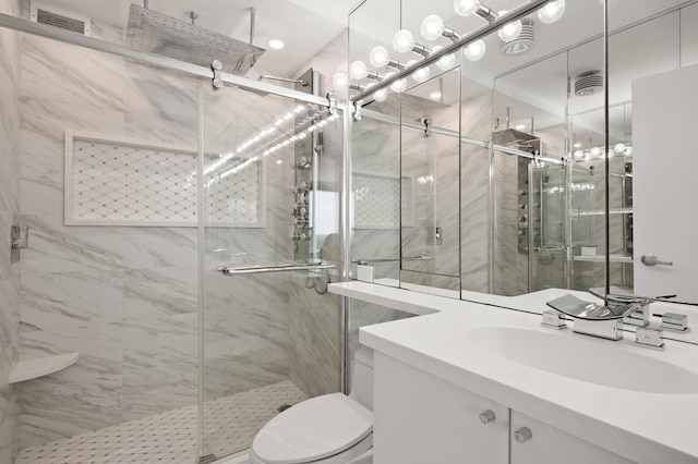 bathroom with visible vents, toilet, vanity, and a marble finish shower