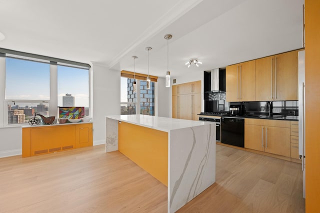 kitchen with a city view, visible vents, hanging light fixtures, black appliances, and wall chimney exhaust hood