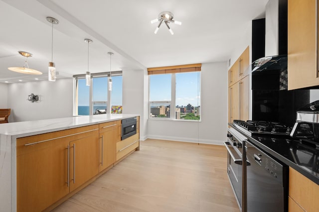 kitchen with black dishwasher, decorative light fixtures, a water view, stainless steel gas stovetop, and wall chimney exhaust hood