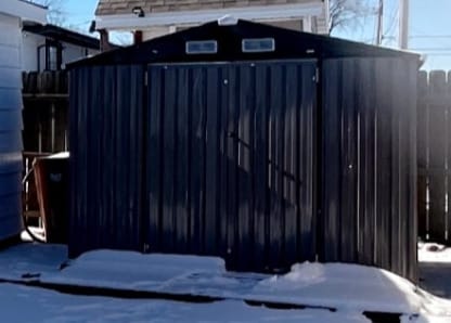 view of snow covered gate