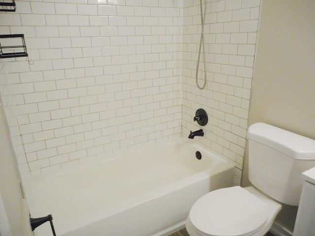 bathroom featuring toilet, vanity, and shower / bathing tub combination