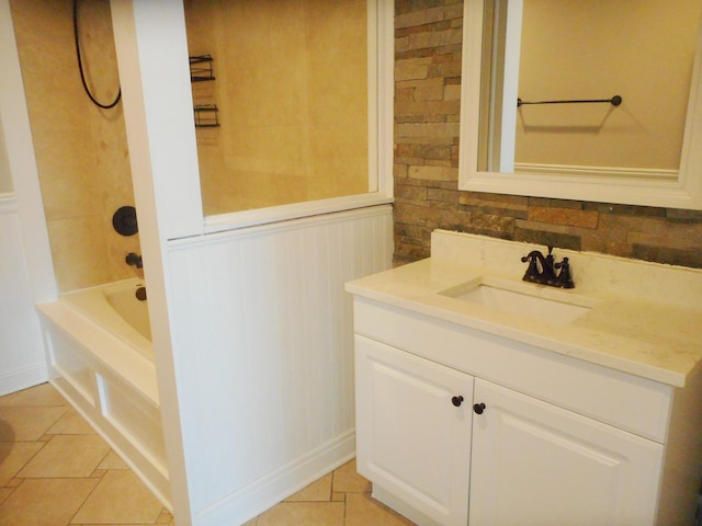 bathroom featuring tile patterned floors, a wainscoted wall, and vanity