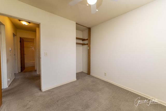 unfurnished bedroom with light carpet, ceiling fan, baseboards, and a closet