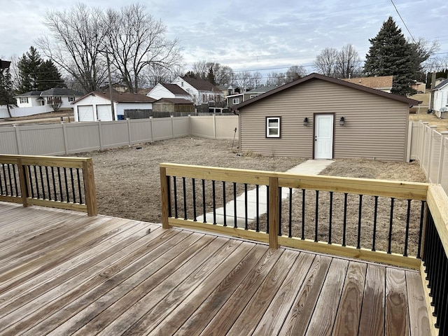 wooden deck featuring a fenced backyard and a residential view