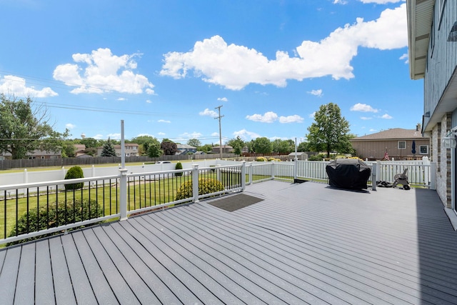 deck featuring a fenced backyard and a yard